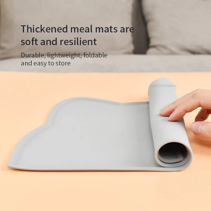 Cat head shaped silicone pet feeding mat in solid colour measuring 44 by 24 centimetres