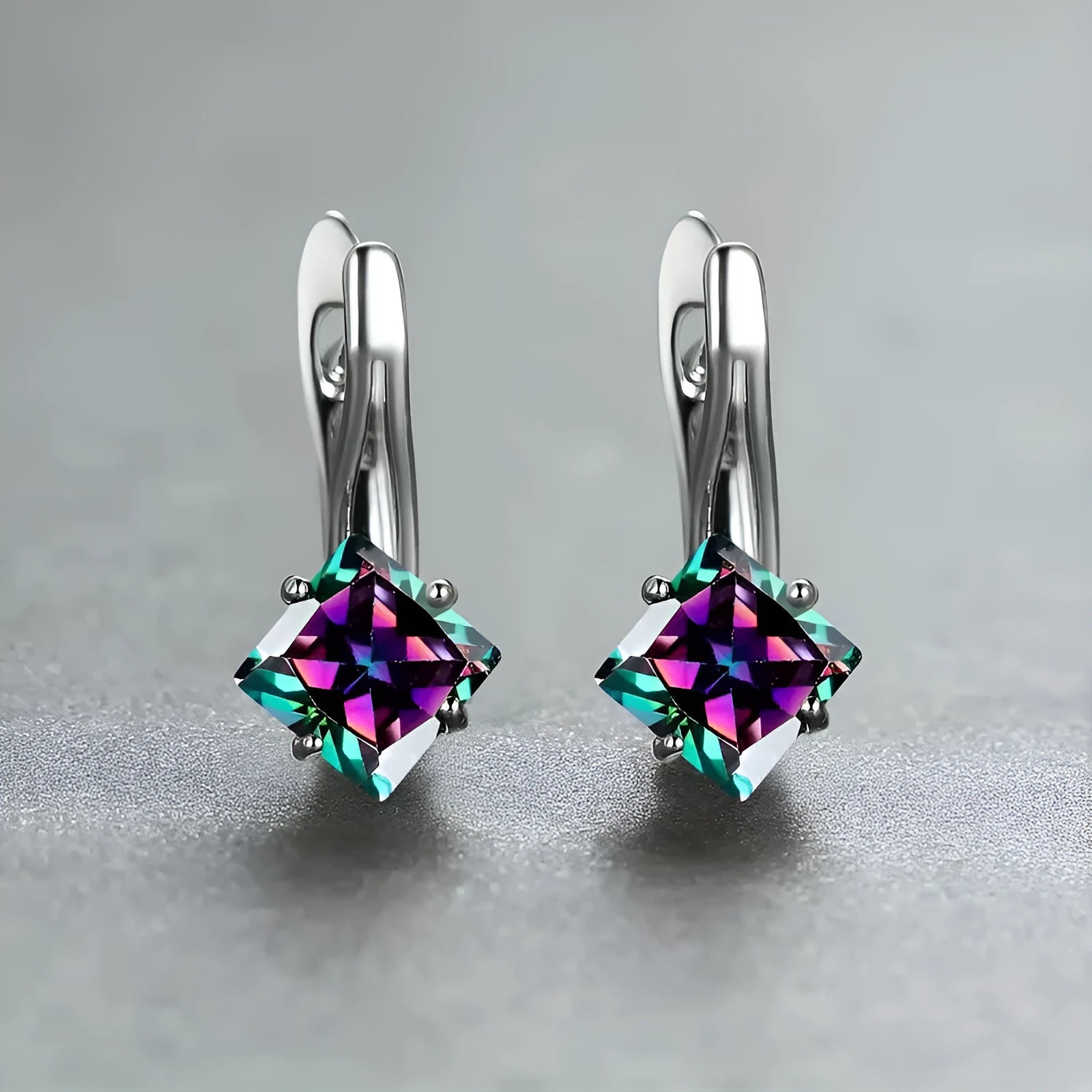 Copper earrings with diamond design and blue zircon inlay for women.