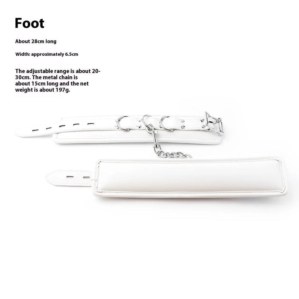 White PU sponge bondage restraint set showing handcuffs, foot cuffs, and a neck cuff.