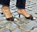 Apricot and black women's stiletto heel sandals with a pointed toe and buckle strap