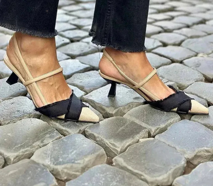 Apricot and black women's stiletto heel sandals with a pointed toe and buckle strap