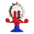 Interactive pet puzzle feeder with spinning dispenser and suction cup base in blue green red yellow colours