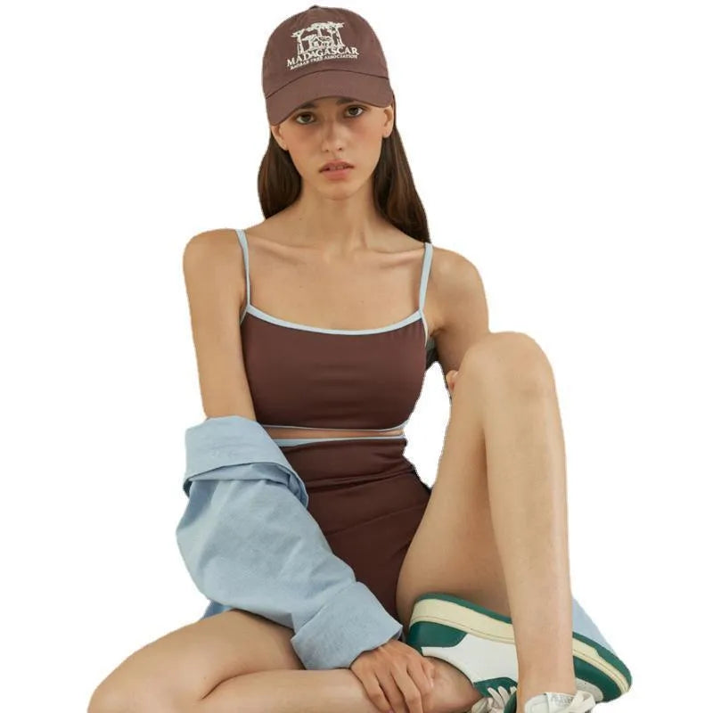 Brown women's triangle one-piece swimsuit with a pattern, shown on a hanger