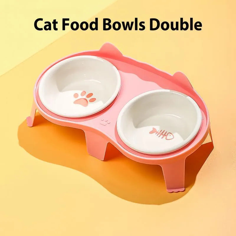 Blue ceramic cat bowl set on white elevated stand with hook, showing tilted food and water dishes.