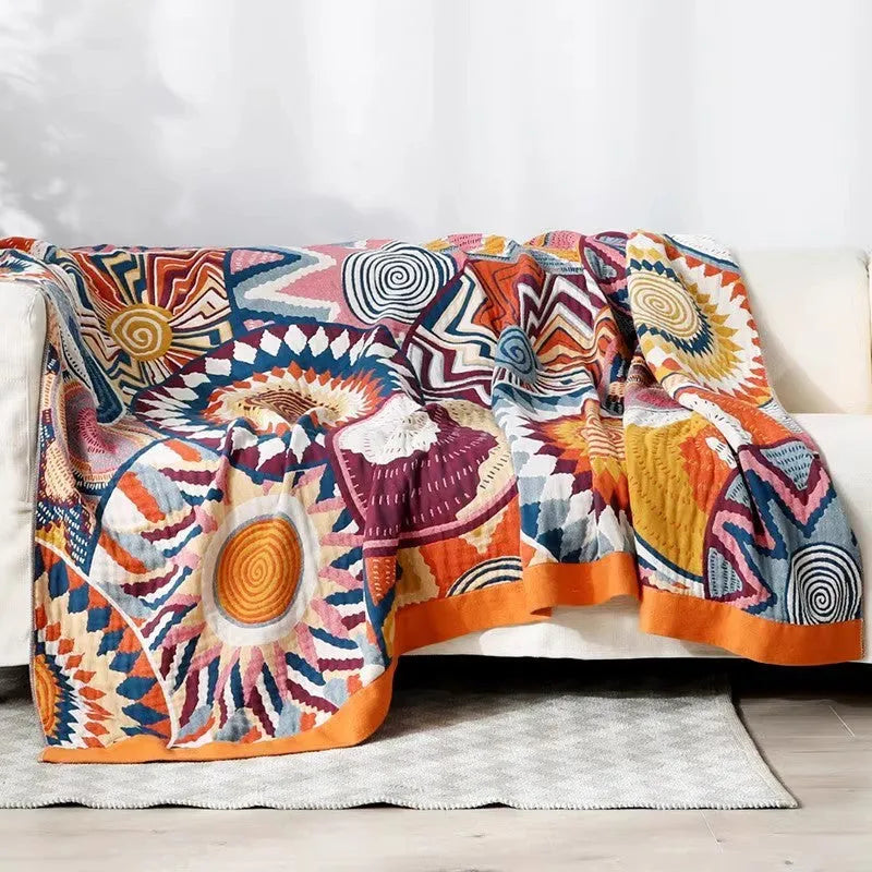 Five-layer cotton gauze bed sheet blanket in Roulette Wheel Blue pattern showing reactive dye printing detail