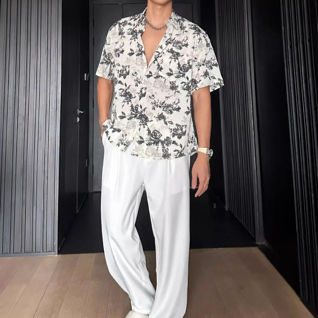 Men's black floral print short sleeve casual shirt with a loose fit and V-neck.