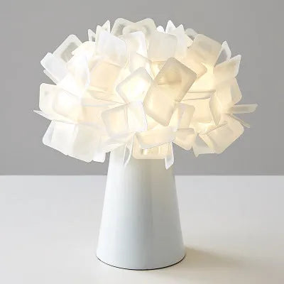Nordic style metal table lamp in a choice of colours showing warm, white, and neutral light settings.