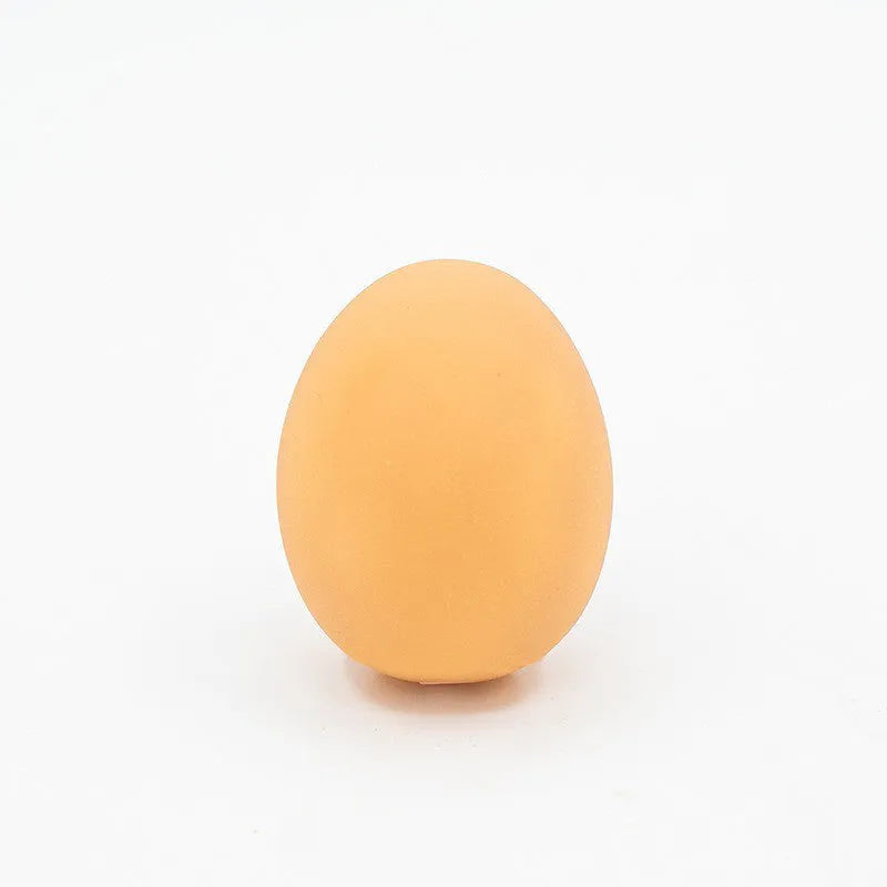 Egg-shaped dog toy with sound simulation for teeth cleaning and interactive play