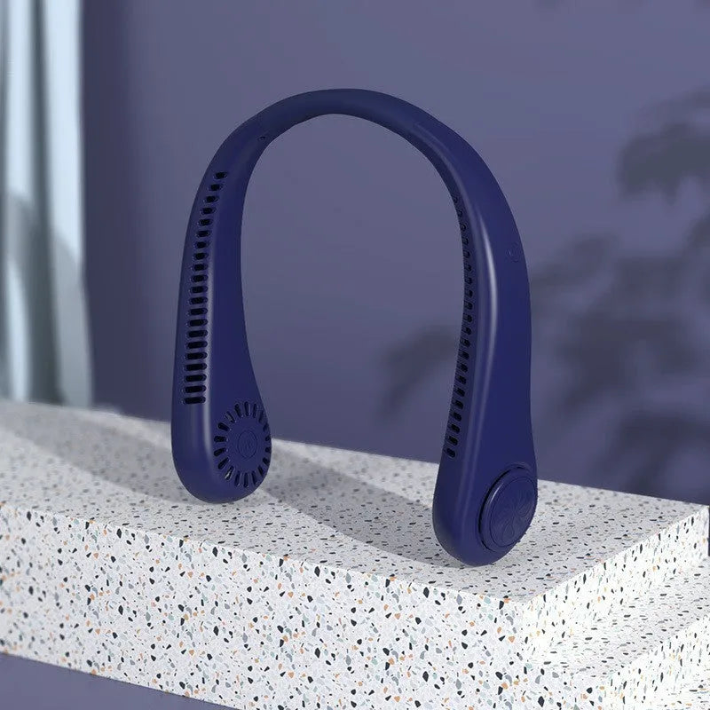 Pink bladeless neck fan hanging with USB cable for charging.