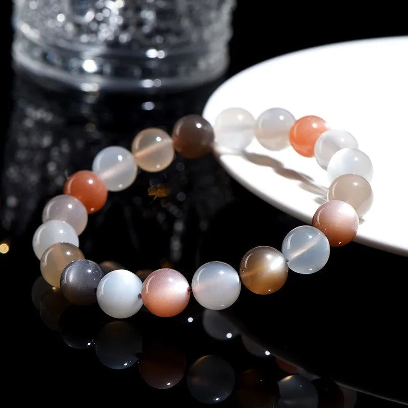Natural moonstone bracelet with colourful light variation showing 8mm beads in single circle configuration