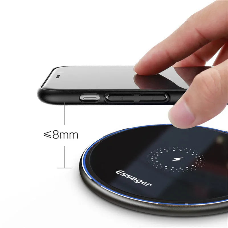 Black or white 15W Qi fast wireless charging pad with LED indicator light on anti-slip aluminium base.
