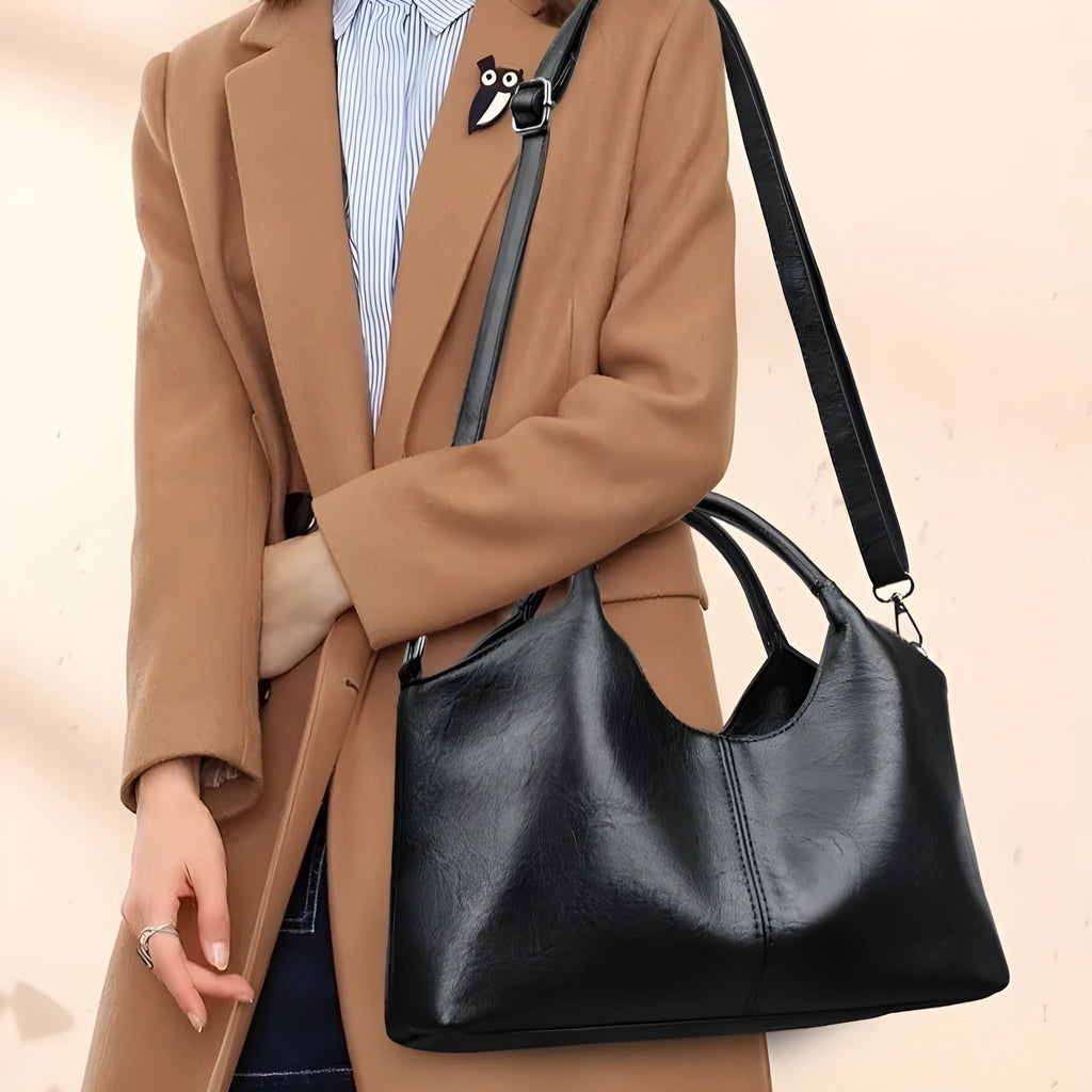 Women's genuine leather cross-body bag in seven colour options showing large capacity main compartment