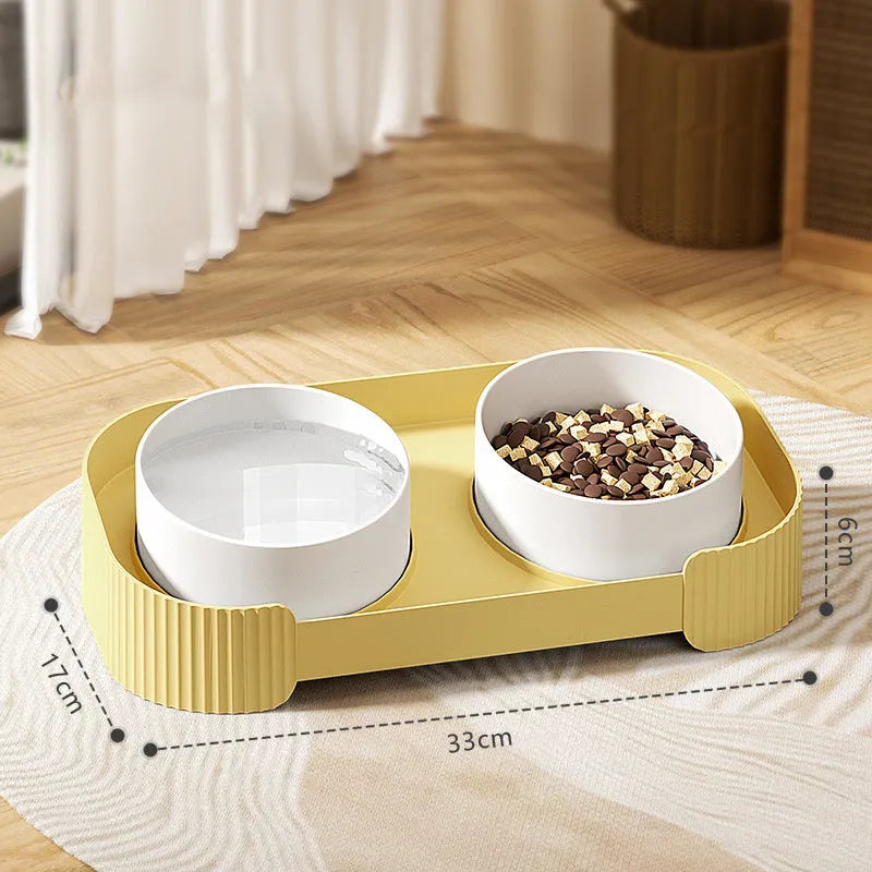 Green ceramic elevated cat bowls with tilted design on non-slip base for food and water