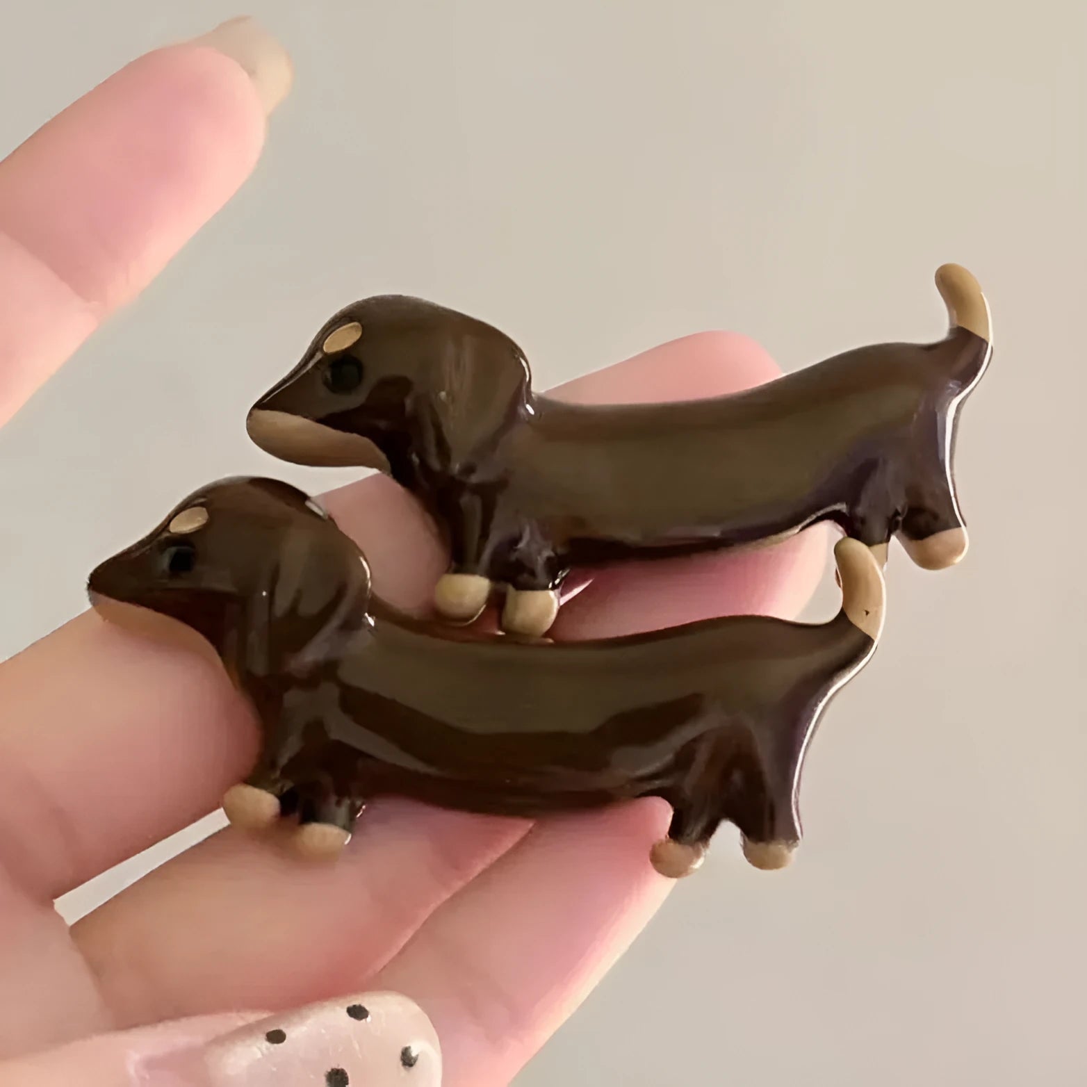 Dachshund dog design hair barrettes with electroplated finish, showing front and back views