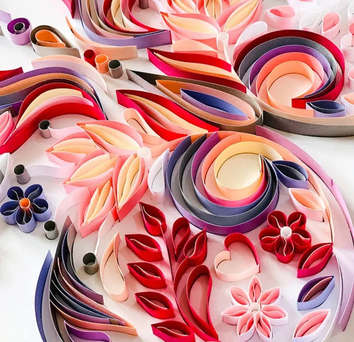 20 inch handmade butterfly quilling paper ornament with assembly tools on blue background
