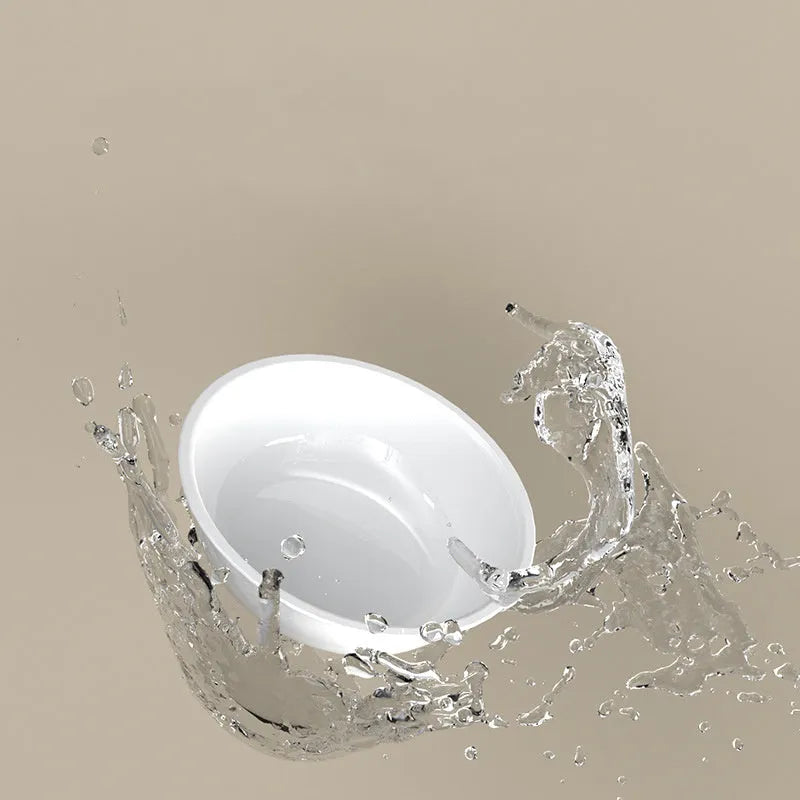 Green tilted stainless steel pet bowl showing 15-degree feeding angle