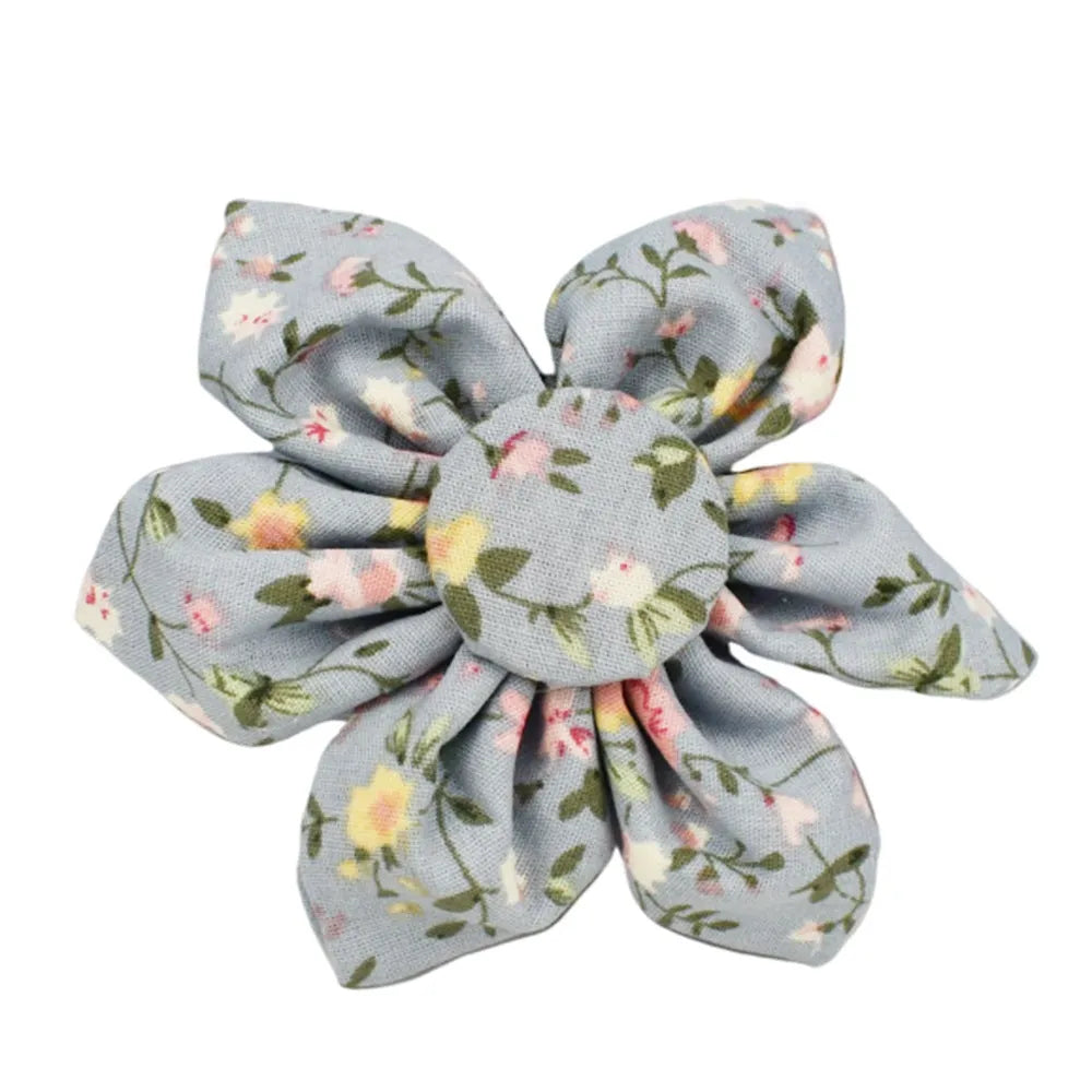 Blue floral pattern dog collar set with matching leash, vest, and accessories on white background