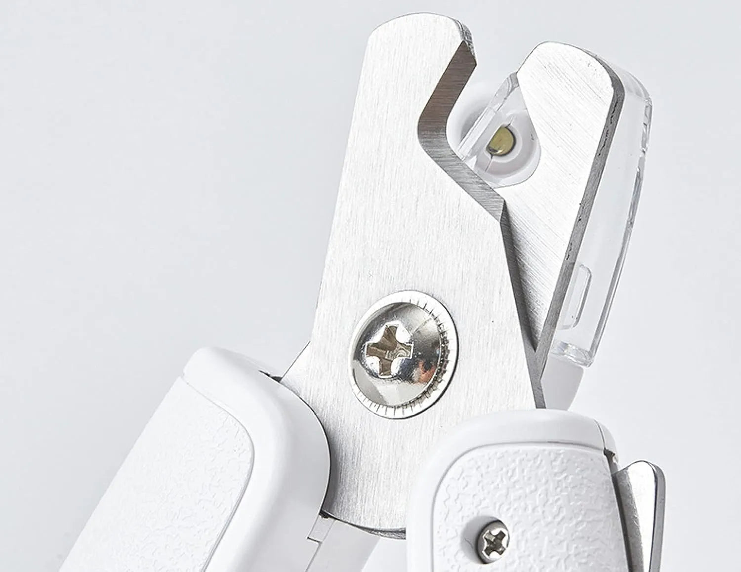 White pet nail clippers with LED light, transparent anti-splash guard open, and separate nail file.