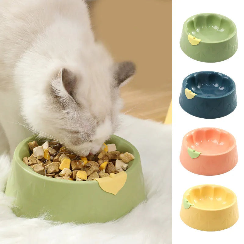 Green plastic double pet bowl for cats and dogs with anti-tipping base and separate food and water compartments