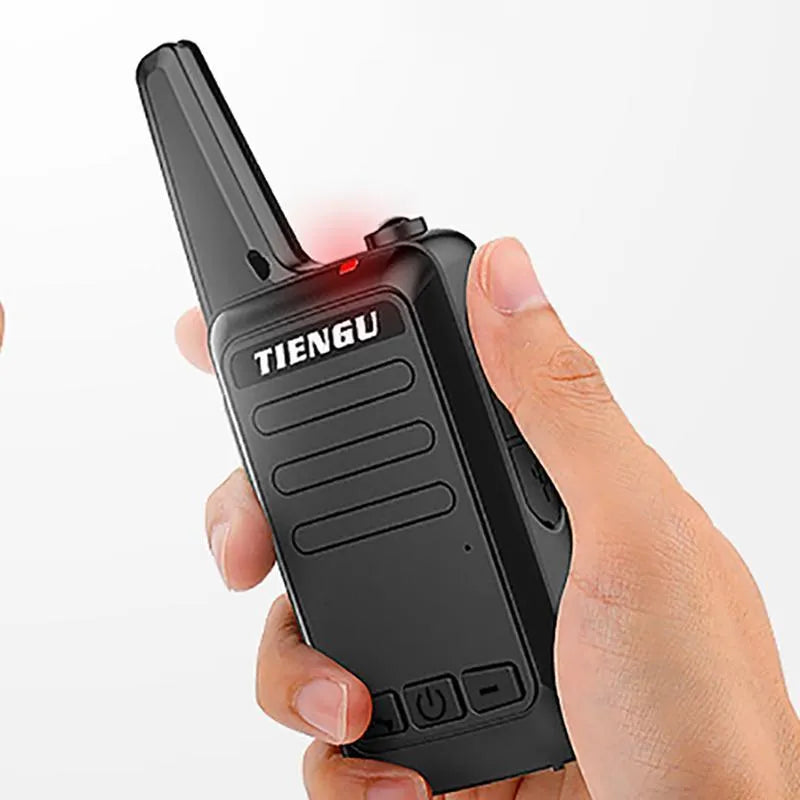 TIENGU black wireless handheld radio with LED flashlight, USB port, and back clip on a white background