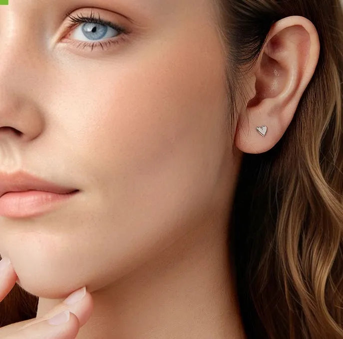 S925 sterling silver heart shaped stud earrings for women, electroplated finish, single pair on white background