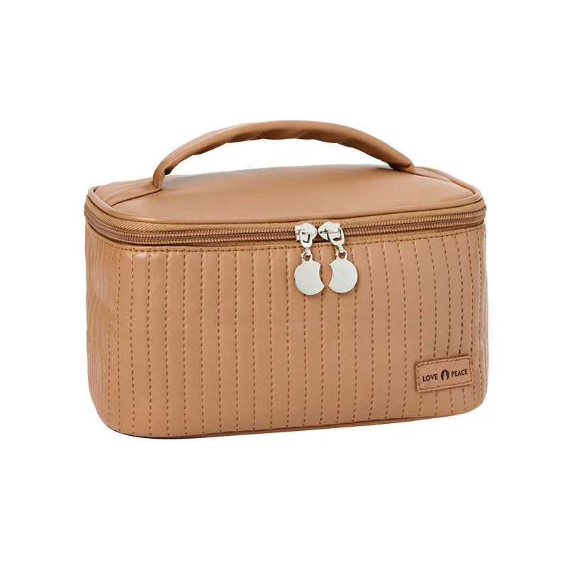 Open-top cake-shaped makeup bag in PU leather, shown in one of six available colours.