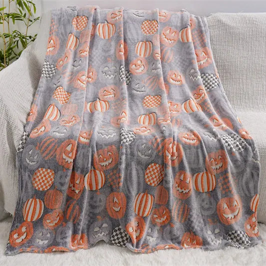 Cartoon-pattern flannel blanket laid flat, showing one of five colour options, suitable as a child's blanket or AC cover.