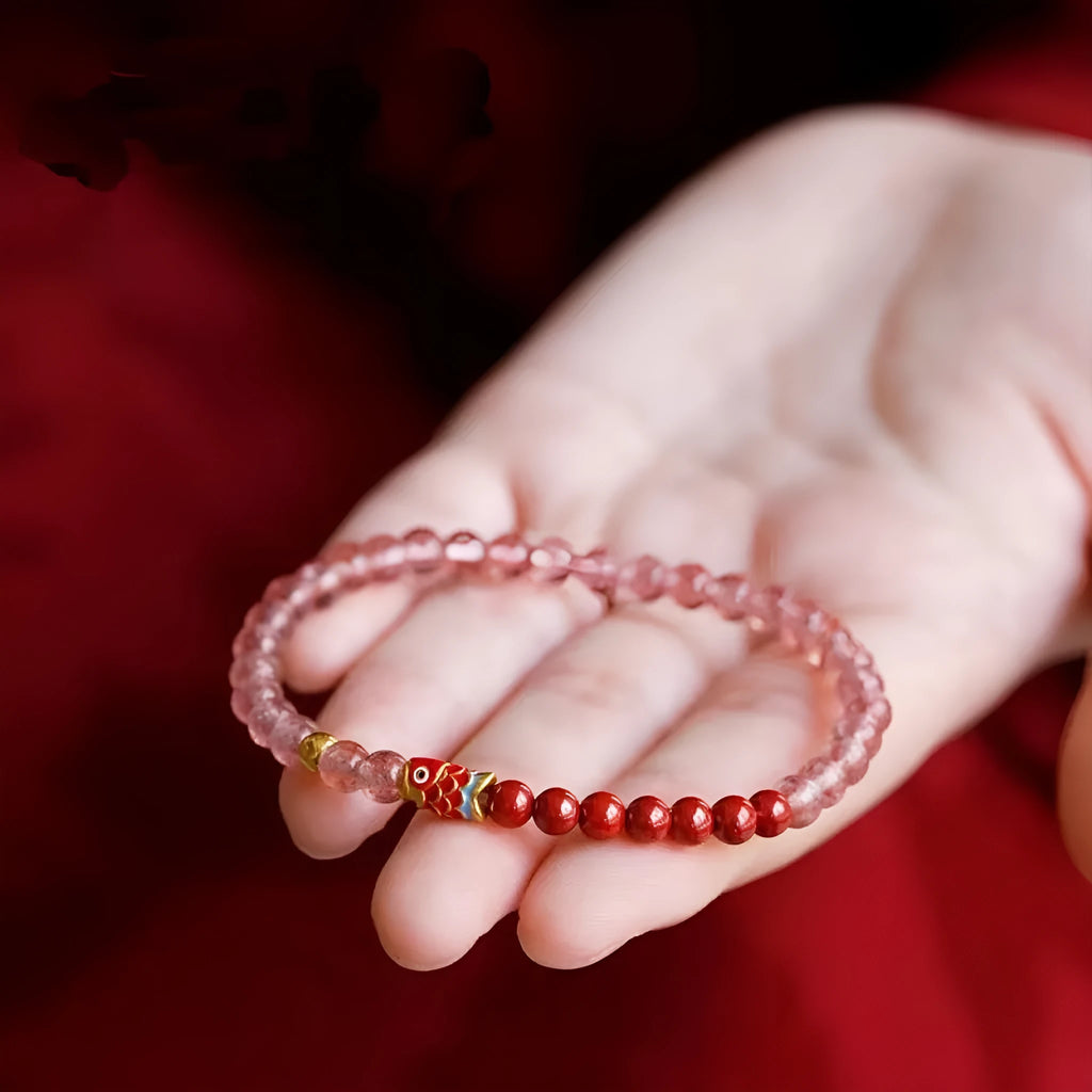 Women's purple cinnabar bracelet with strawberry quartz stones and Koi pattern design