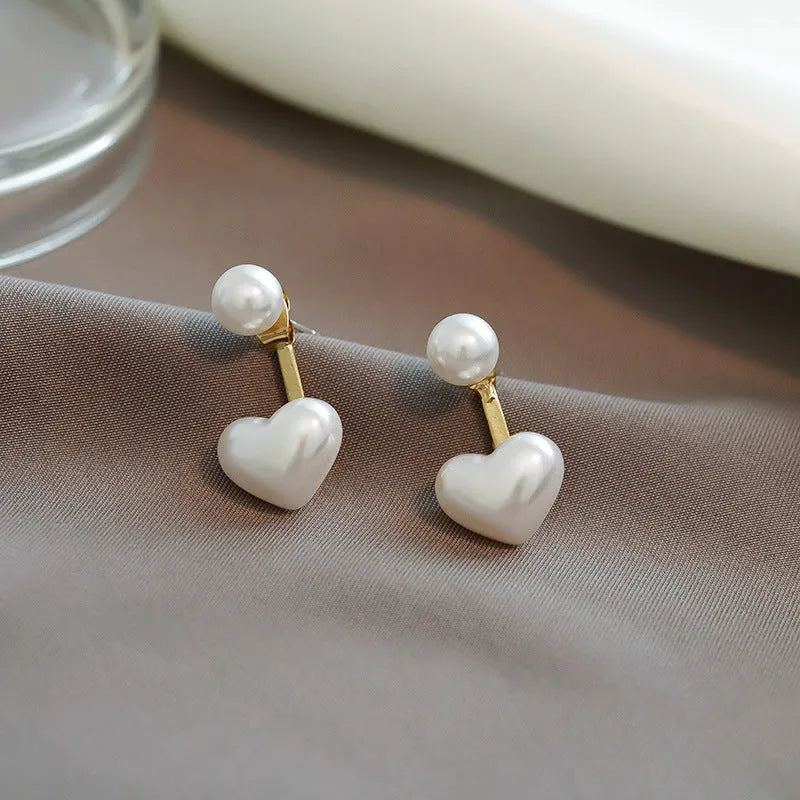 Korean style heart-shaped women's stud earrings with artificial pearl inlay on alloy posts