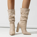 Women's black suede ankle boots with a chunky high heel and pointed toe.
