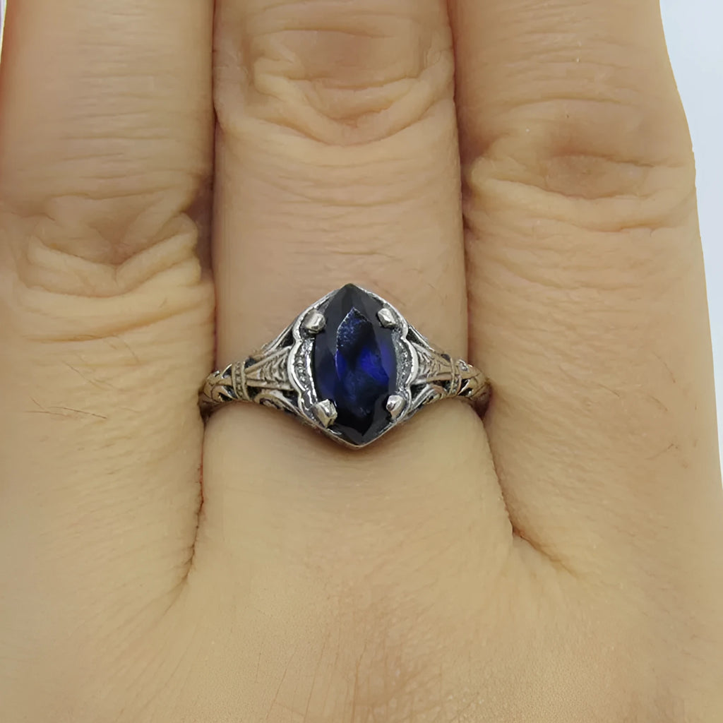 Silver geometric hollow women's ring shown in alloy with electroplated finish