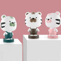 Cartoon-style animal table lamp with LED light in bear, cattle, rabbit, or tiger design on a table.
