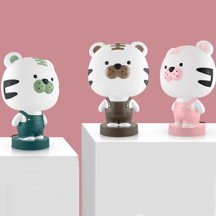 Cartoon-style animal table lamp with LED light in bear, cattle, rabbit, or tiger design on a table.