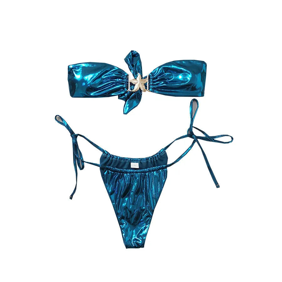 Women's glossy sapphire blue bikini with gold starfish print, showing backless two-piece design.