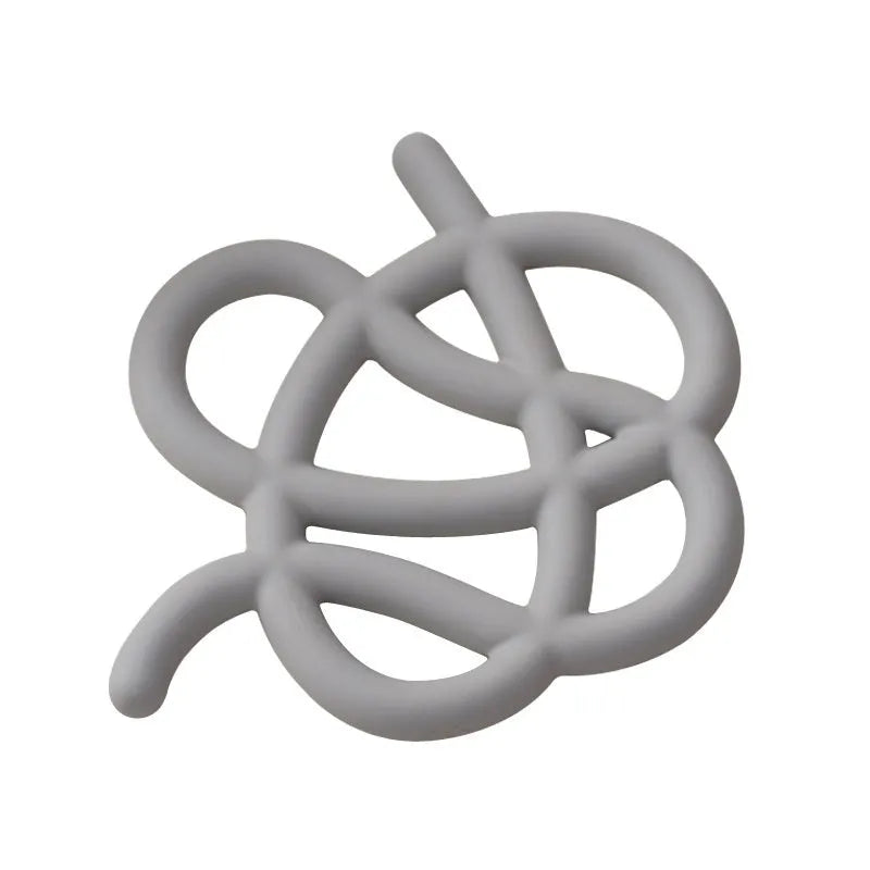 Ceramic heat proof mat with irregular organic shape in solid colour for dining table protection