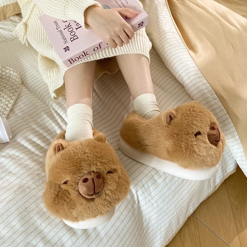 Light brown women's winter plush slippers with cartoon pattern and artificial wool lining.