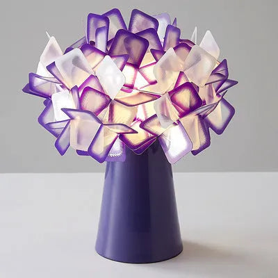 Nordic style metal table lamp in a choice of colours showing warm, white, and neutral light settings.