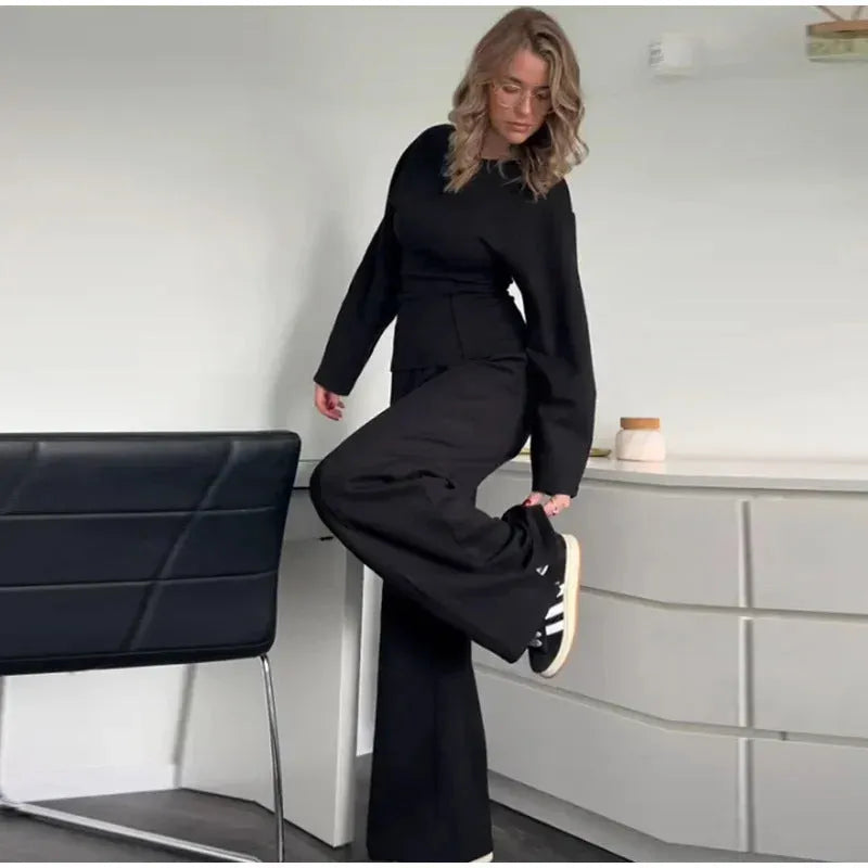 Women's polar fleece suit set showing O-neck pleated top with long sleeves and matching wide leg trousers