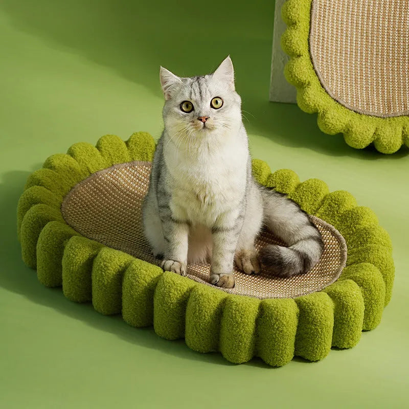 Green oval cat scratch pad and lounger bed made from sisal fabric.