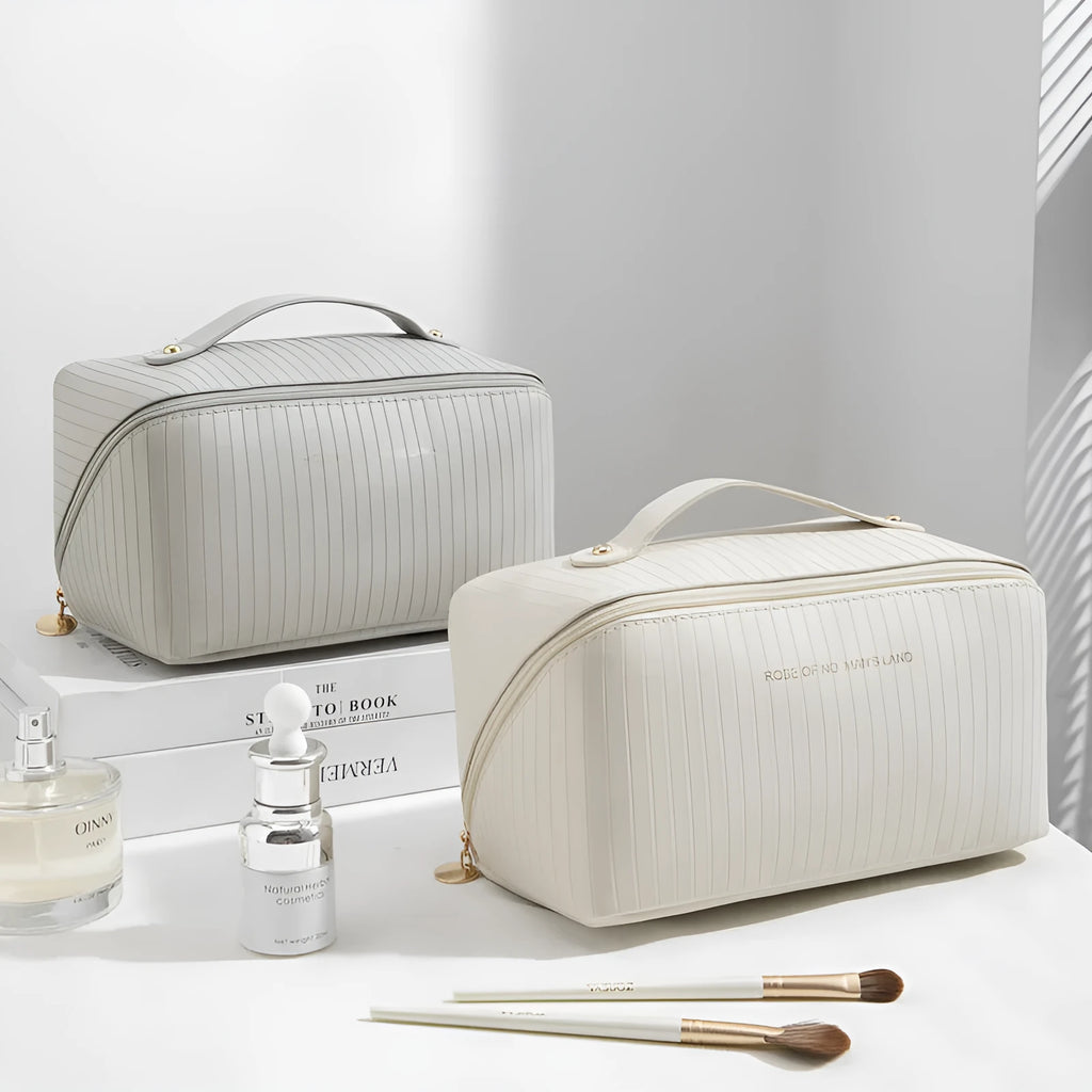 Vertical pattern pillow makeup bag with cubic shape measuring 22.5cm in PU material