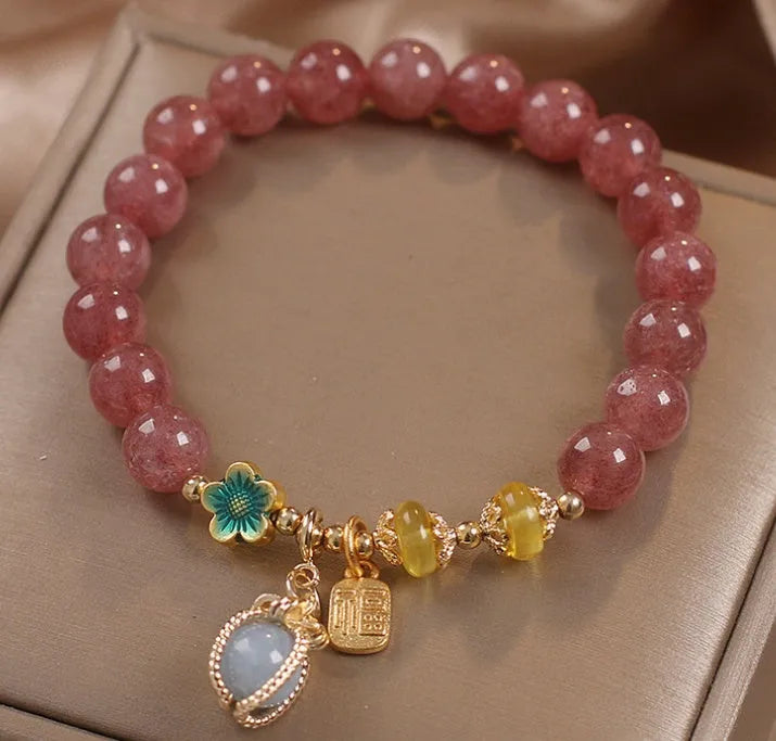 Red strawberry quartz design beaded bracelet for women with alloy metal and rhinestones.