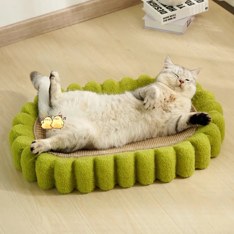 Green oval cat scratch pad and lounger bed made from sisal fabric.
