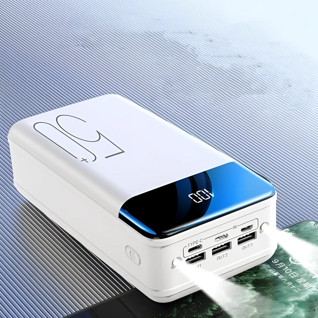 Black and white 50000mAh power bank showing three output USB ports and three input charging ports