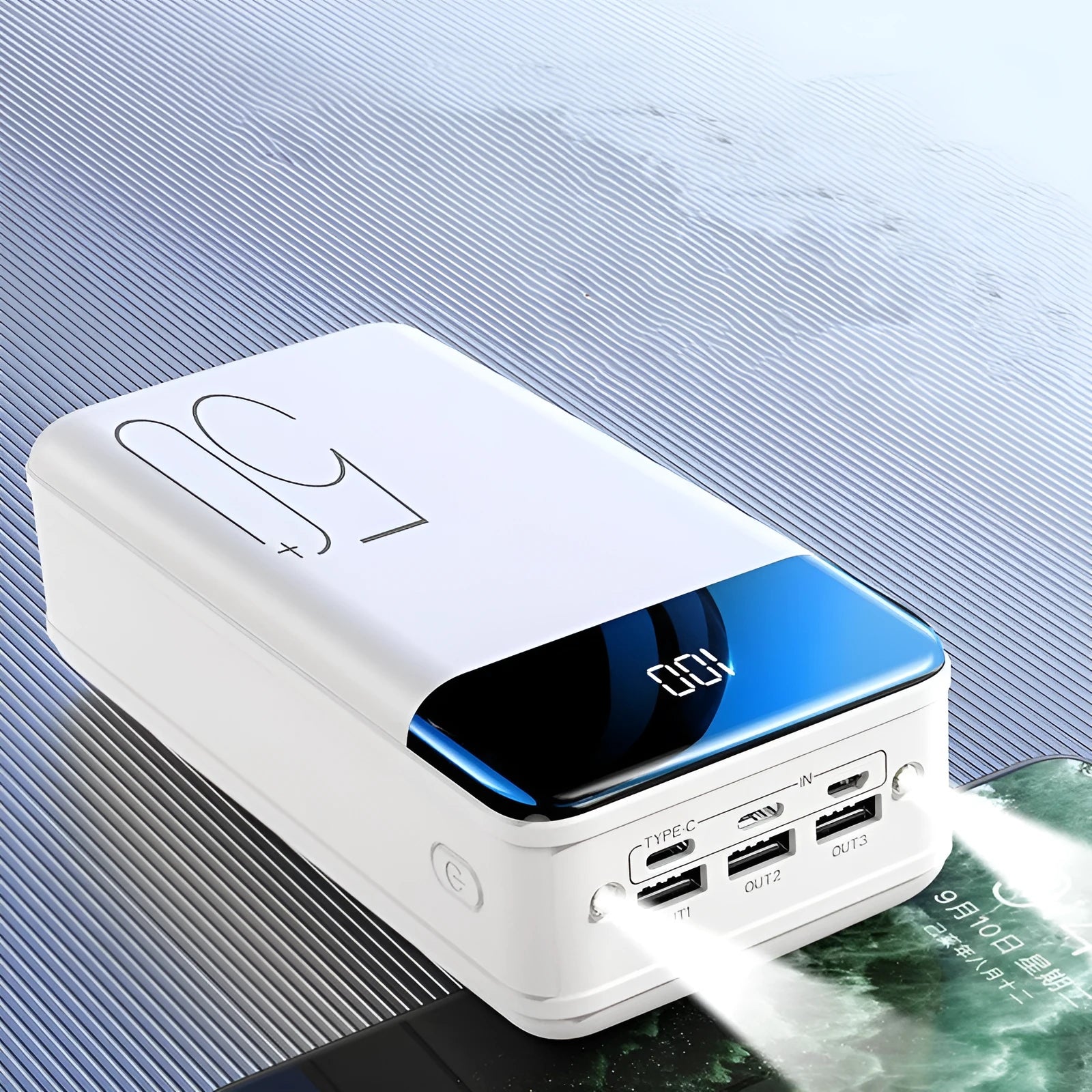 Black and white 50000mAh power bank showing three output USB ports and three input charging ports