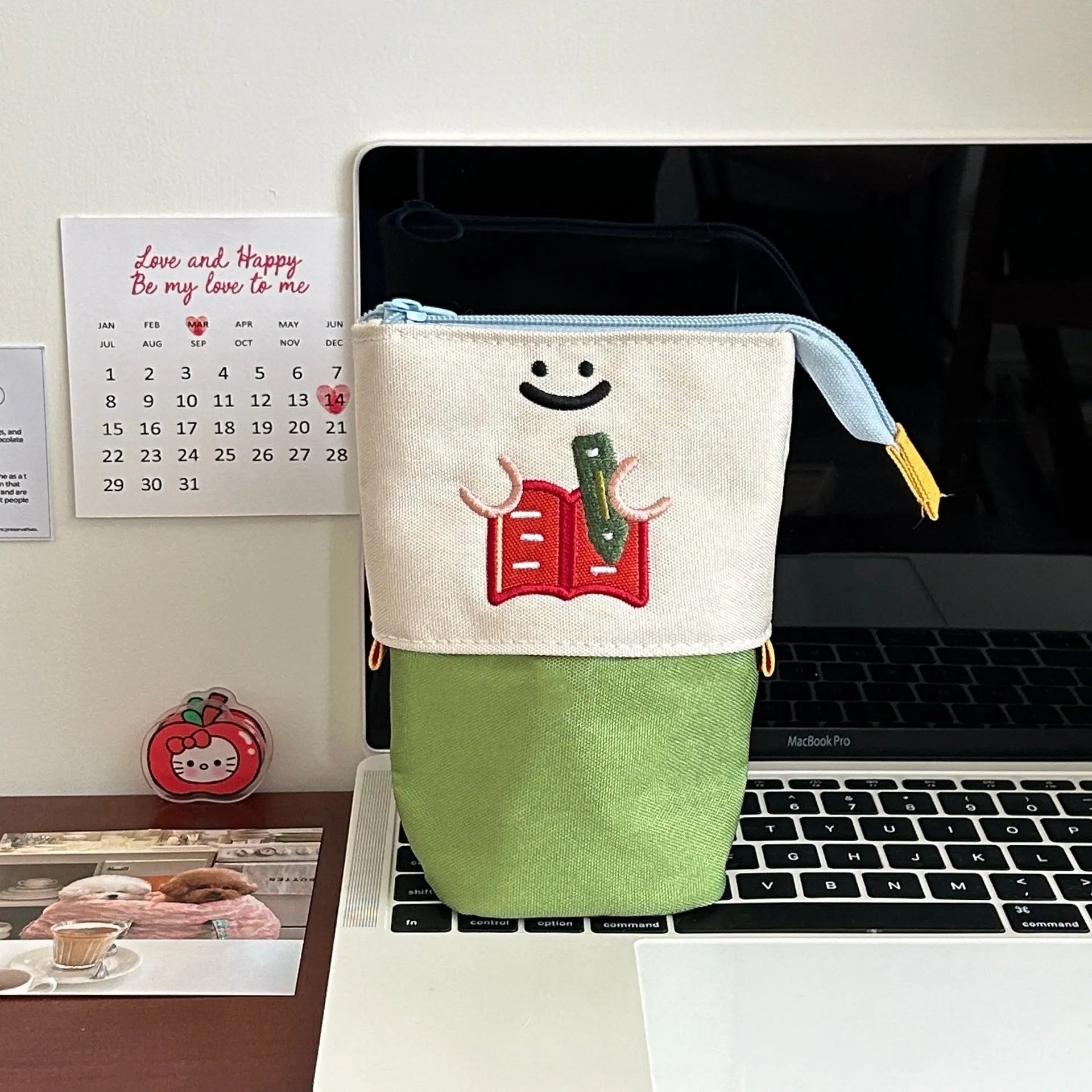 Brown and green collapsible cartoon pencil case made from Oxford fabric, shown with dimensions 17cm by 14cm.