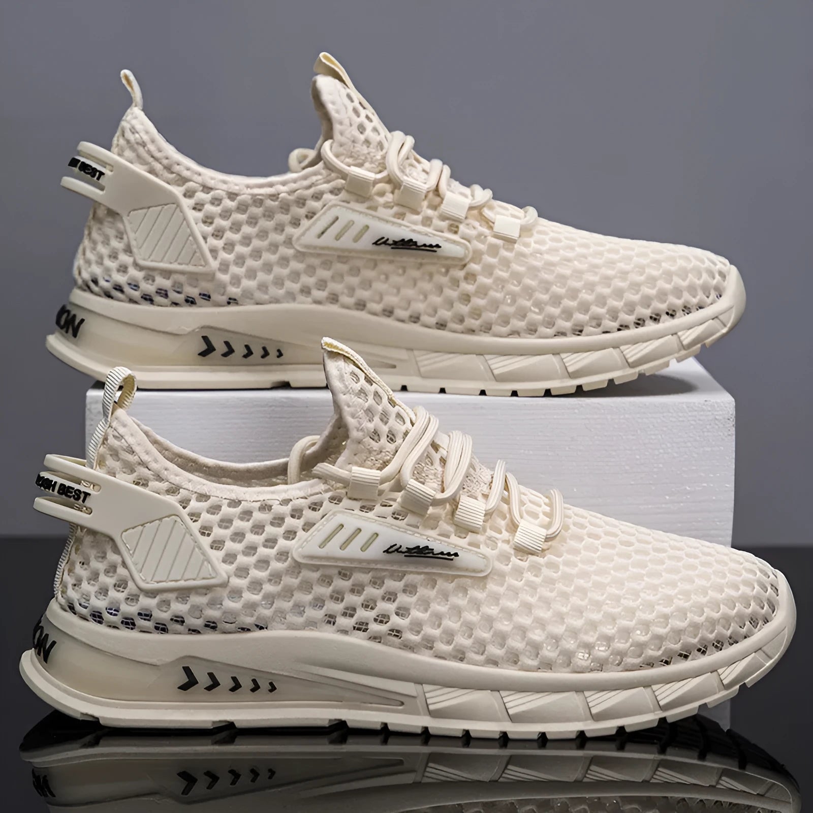 Men's beige casual sneaker with synthetic leather upper and mesh lining, shown with lace-up front.