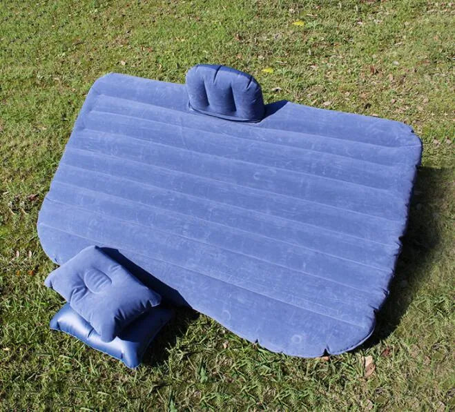 Ultra-thickened flocking cloth inflatable bed set up on a car rear seat with two pillows.