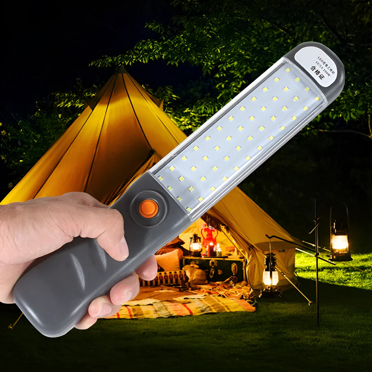 Grey multifunctional LED work light with magnetic base and 360° rotation on a metal surface