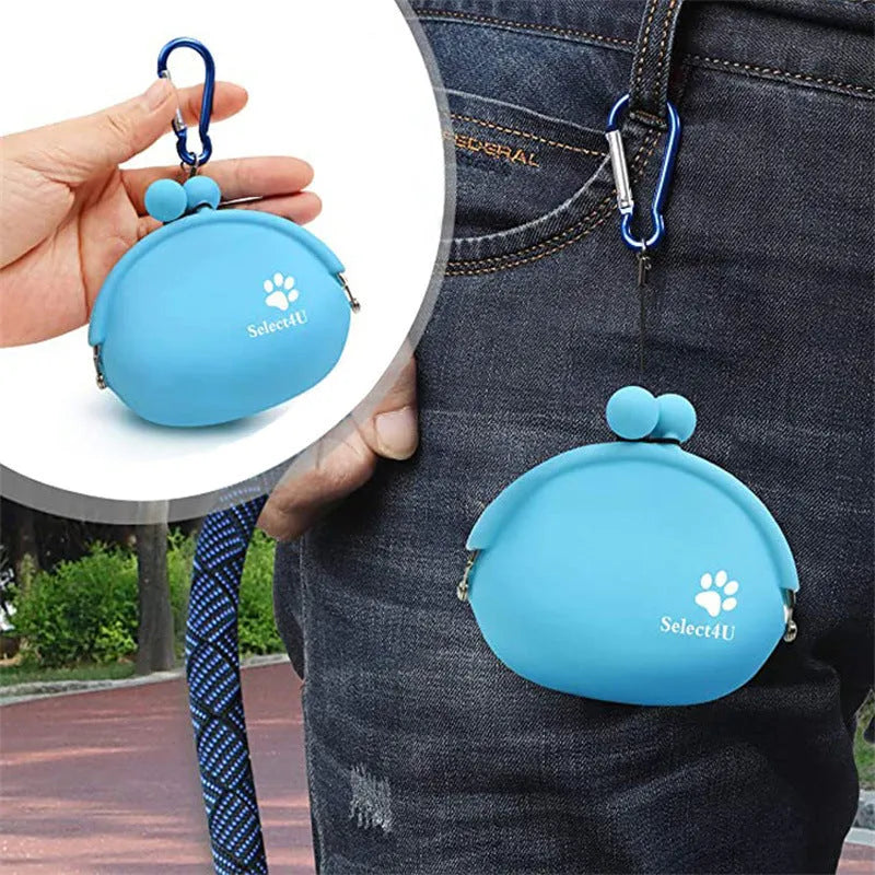 Yellow silicone dog training treat bag with hook-and-loop strap, shown attached to a waistband.