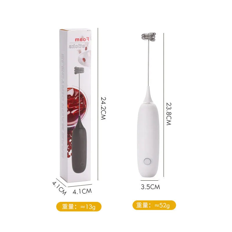 Black and white hand-held electric milk frother blender for coffee preparation